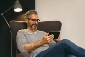 Smiling Man with Tablet