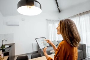 Woman managing Smart Home with a Tablet